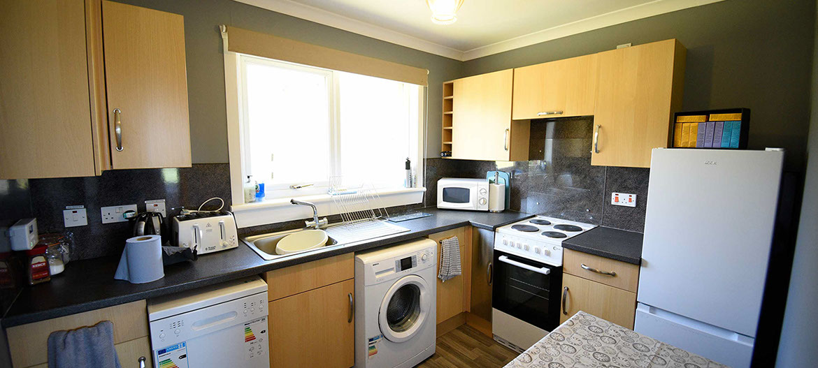 Kenmore Cottage self catering accommodation contains a modern kitchen with oven microwave kettle and fridge freezer