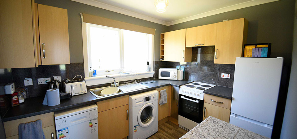 Kenmore Cottage self catering accommodation contains a modern kitchen with oven microwave kettle and fridge freezer
