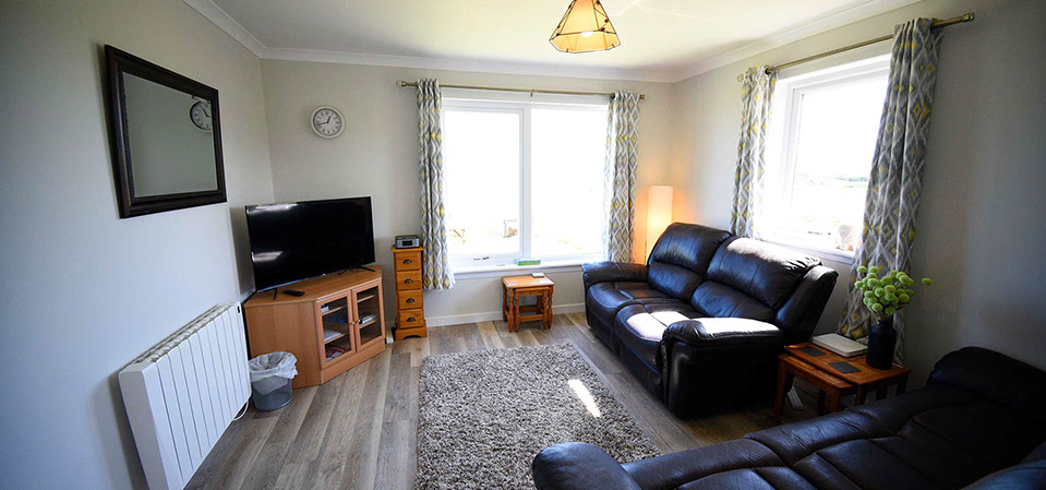 Anmara self catering accommodation contains a comfortable living room with sea views and widescreen TV